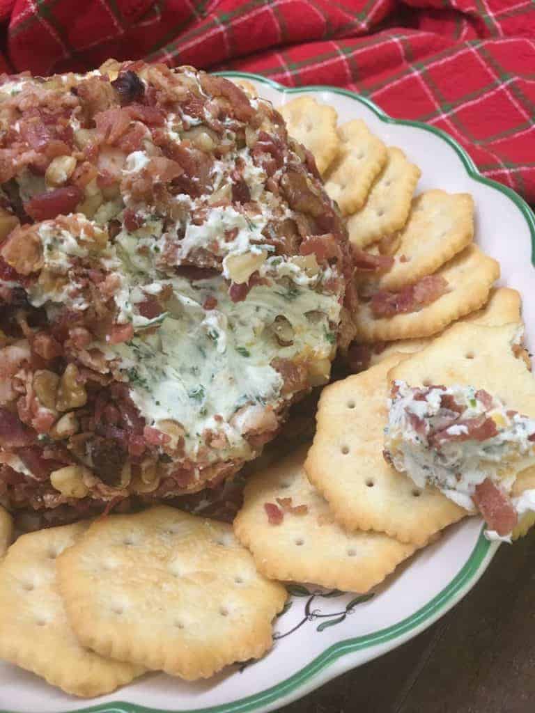 Easy Holiday Bacon Ranch and Walnut Cheeseball is a classic holiday appetizer. The cheeseball is the perfect food to bring to any party. I use pre made real bacon to make it quick and get it ready to eat.