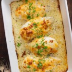 baked chicken in a casserole dish with cheese on top.