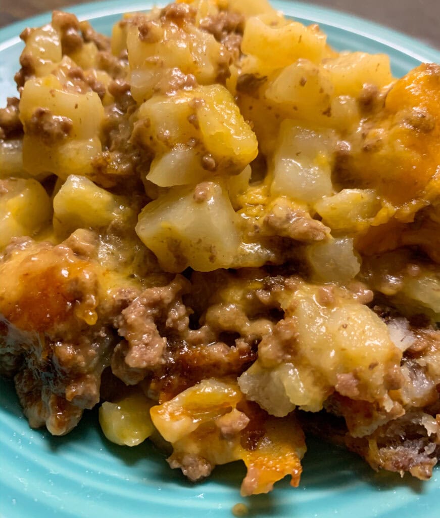 5-ingredient ground beef casserole cooked and on a light blue plate.