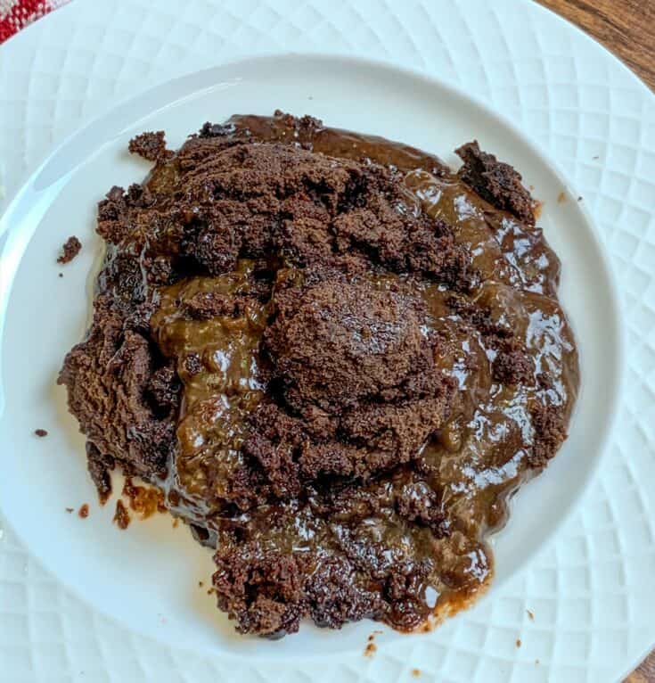 Slow cooker chocolate cake on a white plate