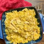 Shredded chicken and Spanish rice in a blue bowl