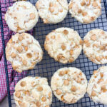 Cake mix cookies with butterscotch chips on a cookie rack.