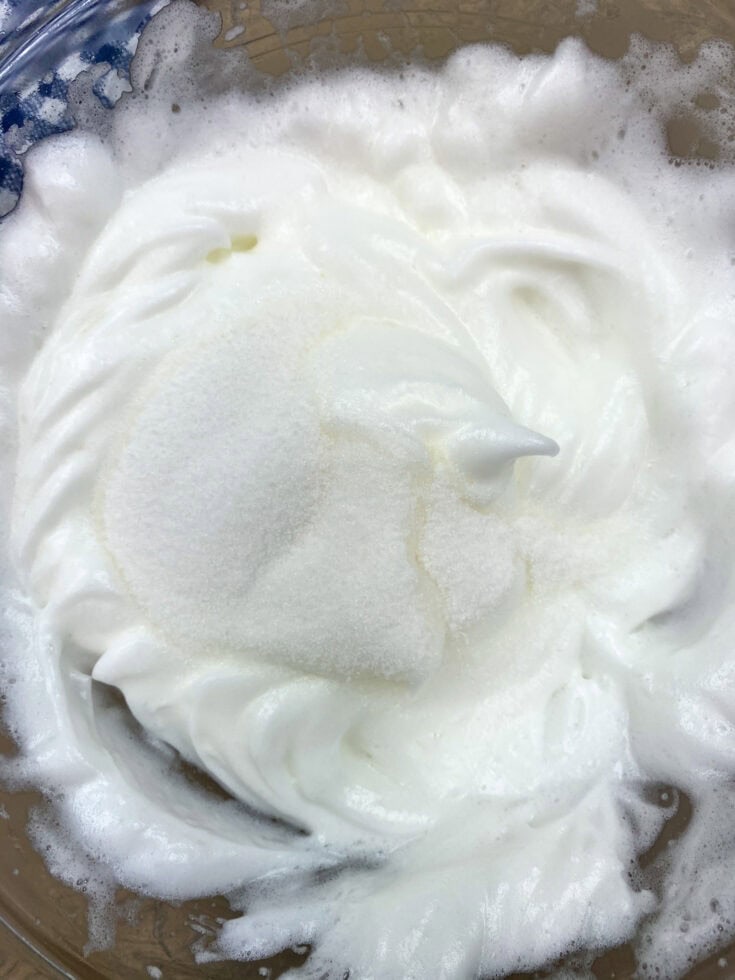 Meringue with sugar on top, in a glass bowl. 