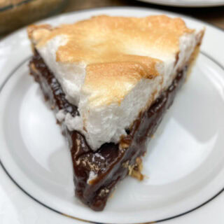 Chocolate Pie sliced and on a plate.