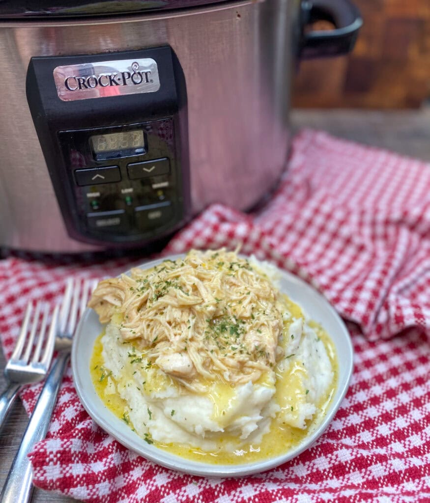 https://www.backtomysouthernroots.com/wp-content/uploads/2021/04/Easy-slow-cooker-chicken-and-gravy-with-mashed-potatoes-875x1024.jpg