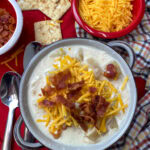 Creamy chicken and potato soup in a bowl.