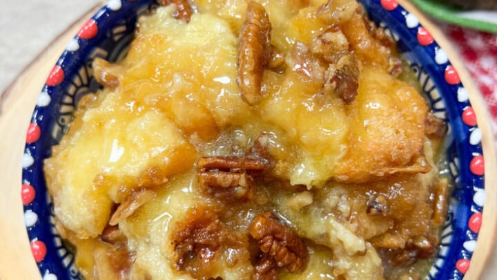 Bread pudding in a bowl with blue and red.