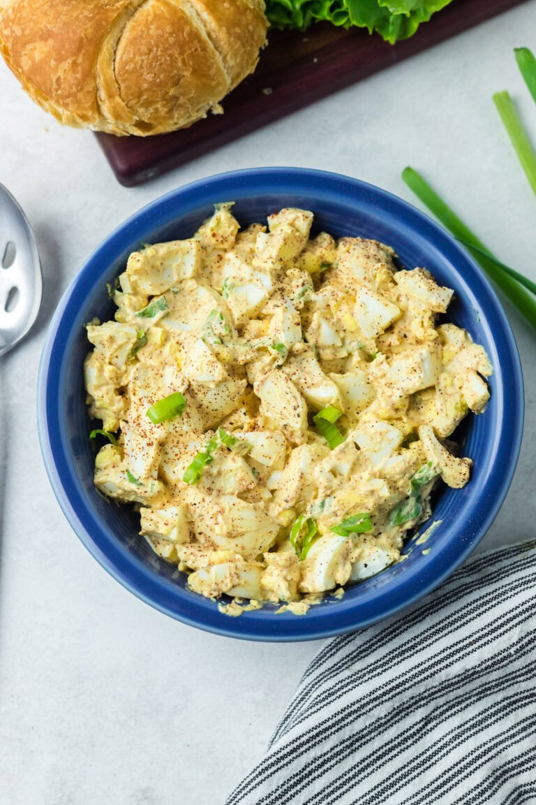 Deviled egg salad in a blue bowl.