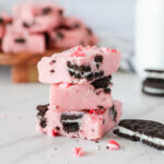 Peppermint fudge pieces stacked on top of each other.