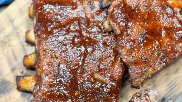 BBQ pork ribs on a cutting board.