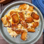 tater tot casserole with chicken on a plate.